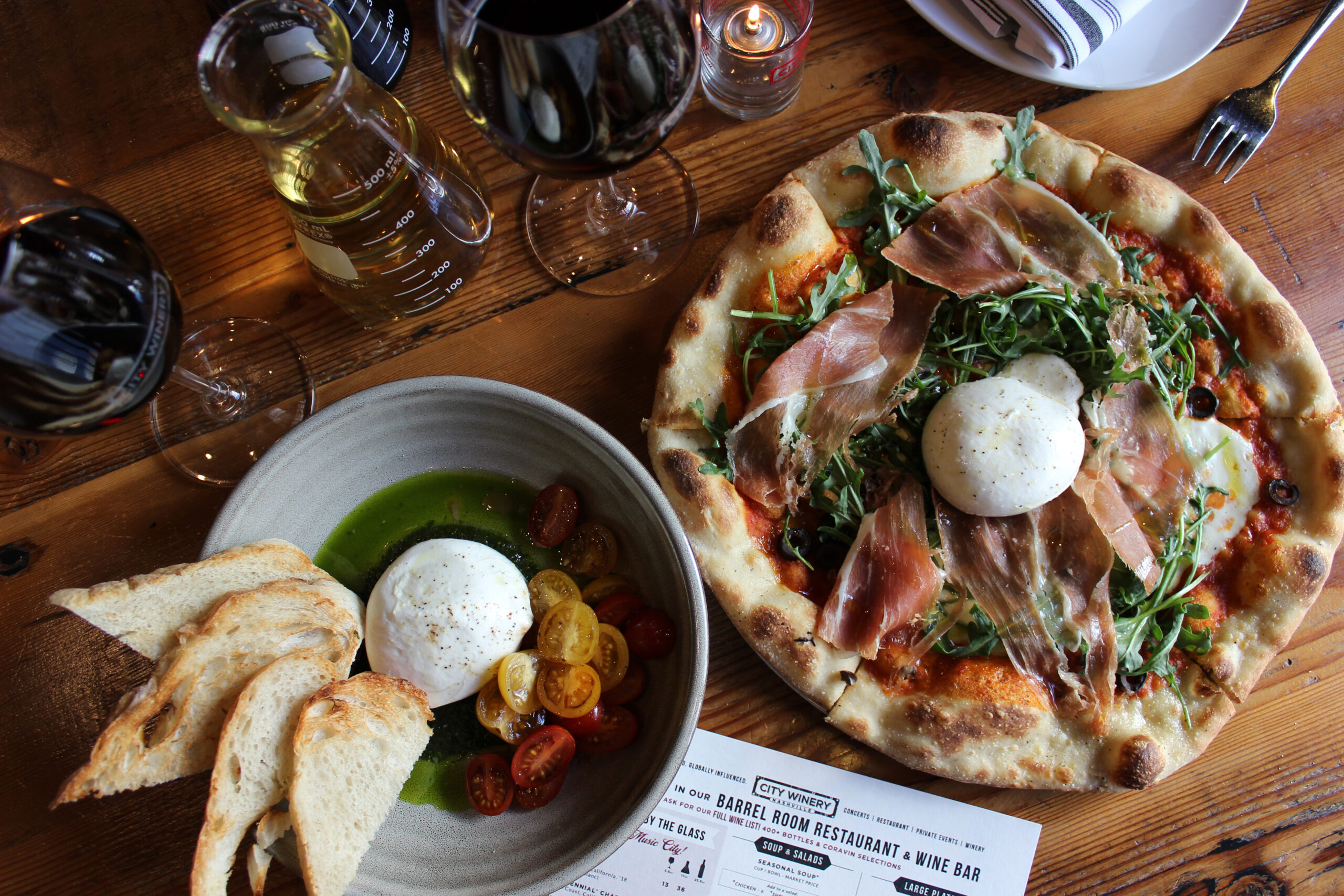 Flatbread pizza and glasses of wine