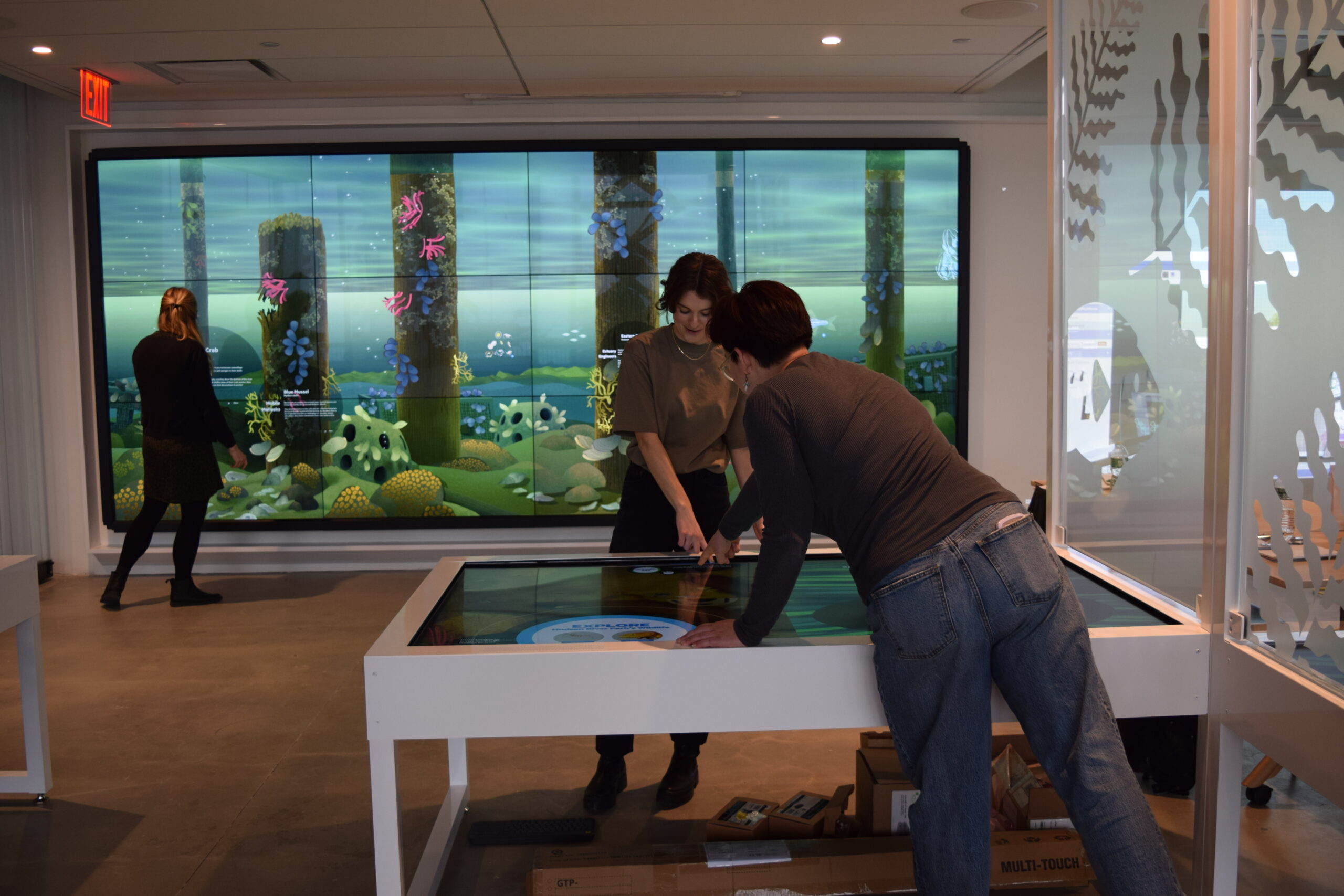 Playing with interactive features at the Discovery Tank at Pier 57