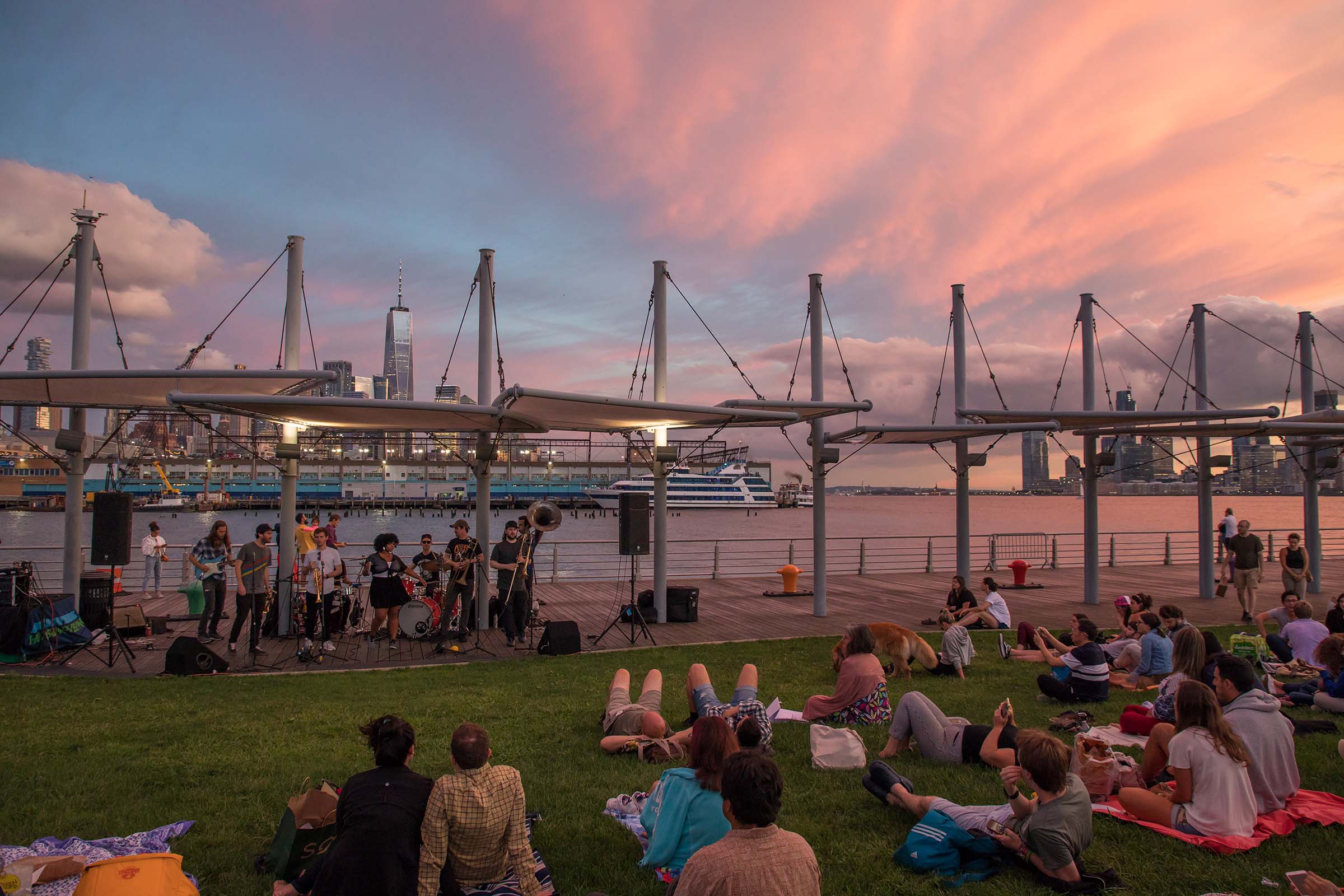 The red hues of the sky as the sunsets and musicians play to the group of Park visitors